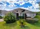 Well-maintained house with attractive landscaping and palm trees at 754 San Joaquin Rd, Kissimmee, FL 34759