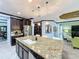Spacious kitchen with granite island, stainless steel appliances, and pendant lighting at 754 San Joaquin Rd, Kissimmee, FL 34759