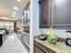 Modern kitchen with dark wood cabinets, granite countertops, and stainless steel appliances at 754 San Joaquin Rd, Kissimmee, FL 34759