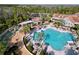 Resort-style pool with lounge chairs and palm trees at 754 San Joaquin Rd, Kissimmee, FL 34759