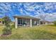 Spacious screened-in patio with outdoor furniture and grill at 754 San Joaquin Rd, Kissimmee, FL 34759