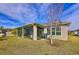 Covered patio with a screened enclosure and view of the yard at 754 San Joaquin Rd, Kissimmee, FL 34759