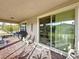 Covered porch with sliding glass doors and seating at 754 San Joaquin Rd, Kissimmee, FL 34759