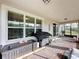 Relaxing screened porch with brick flooring and grill at 754 San Joaquin Rd, Kissimmee, FL 34759