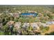 Aerial view of neighborhood with lake in background at 842 Palm Oak Dr, Apopka, FL 32712