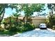 One-story house with a two-car garage and lush landscaping at 921 Rosinia Ct, Orlando, FL 32828