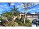 House with palm trees and well-maintained landscaping at 921 Rosinia Ct, Orlando, FL 32828