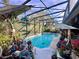 Relaxing screened-in pool area with lush landscaping at 921 Rosinia Ct, Orlando, FL 32828