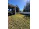 Spacious backyard with screened patio and grassy area at 984 Maypole Dr, Apopka, FL 32703
