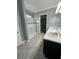 Elegant bathroom with double vanity, shower, and walk-in closet at 984 Maypole Dr, Apopka, FL 32703