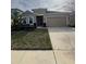 One-story home with attached garage and well-manicured lawn at 984 Maypole Dr, Apopka, FL 32703