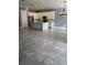 Open concept kitchen with an island and gray tile floors at 984 Maypole Dr, Apopka, FL 32703