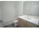 Modern bathroom with white subway tile, sleek vanity, and shower-tub combo at 9856 Sharpless Aly, Orlando, FL 32827