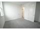 A bright bedroom with two large windows and neutral carpet at 9856 Sharpless Aly, Orlando, FL 32827