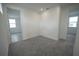 Carpeted bedroom featuring two entryways and natural light from two windows at 9856 Sharpless Aly, Orlando, FL 32827