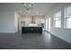Modern kitchen with an island, stainless steel appliances, white cabinets, and gray wood-look floors at 9856 Sharpless Aly, Orlando, FL 32827