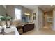 Bright bathroom featuring double sinks with ample counter space and a walk-in shower at 987 Ladyfish Trl, St Cloud, FL 34771