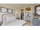 Comfortable bedroom with a walk-in closet and a door leading to the well-lit bathroom at 987 Ladyfish Trl, St Cloud, FL 34771