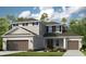 Charming two-story home with a three-car garage and well-manicured lawn and garden at 987 Ladyfish Trl, St Cloud, FL 34771