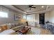 Cozy game room with L-shaped sofa and wet bar at 987 Ladyfish Trl, St Cloud, FL 34771