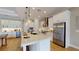 Bright kitchen features a large center island, stainless steel appliances, and custom cabinets at 987 Ladyfish Trl, St Cloud, FL 34771
