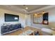 Spacious living room with wood floors, a large TV, and a unique word game decoration at 987 Ladyfish Trl, St Cloud, FL 34771