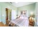 Bedroom with a full bed, additional door and window at 3632 Calabria Ave, Davenport, FL 33897
