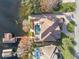 Aerial view of lakefront house with pool and dock at 10018 Lone Tree Ln, Orlando, FL 32836