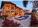Stunning backyard featuring a pool, landscaping and balconies at 10018 Lone Tree Ln, Orlando, FL 32836