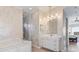Elegant bathroom with a freestanding tub and marble vanity at 10018 Lone Tree Ln, Orlando, FL 32836