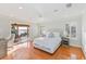 Main bedroom with water view and hardwood floors at 10018 Lone Tree Ln, Orlando, FL 32836