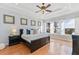 Spacious primary bedroom with water views and hardwood floors at 10018 Lone Tree Ln, Orlando, FL 32836