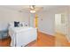 Well-lit bedroom featuring hardwood floors and a walk-in closet at 10018 Lone Tree Ln, Orlando, FL 32836