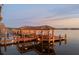 Private boat dock with covered seating area at 10018 Lone Tree Ln, Orlando, FL 32836