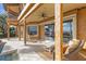 Relaxing covered patio offers comfortable seating and stunning lake views at 10018 Lone Tree Ln, Orlando, FL 32836