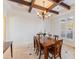 Elegant dining room featuring a wood table, chandelier, and large window at 10018 Lone Tree Ln, Orlando, FL 32836