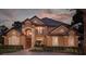 Beautiful two story home with manicured landscaping at 10018 Lone Tree Ln, Orlando, FL 32836