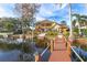 House exterior with lake view and dock at 10018 Lone Tree Ln, Orlando, FL 32836