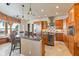 Large kitchen with island, breakfast nook, and water views at 10018 Lone Tree Ln, Orlando, FL 32836