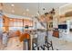Open concept kitchen with island and living room view at 10018 Lone Tree Ln, Orlando, FL 32836