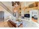 Open living area with high ceilings and staircase leading upstairs at 10018 Lone Tree Ln, Orlando, FL 32836