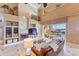 Living room with built-in shelving, fireplace, and waterfront view at 10018 Lone Tree Ln, Orlando, FL 32836
