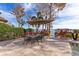 Enjoy al fresco dining on this patio with lake views and a large umbrella for shade at 10018 Lone Tree Ln, Orlando, FL 32836