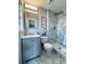 Updated bathroom with gray vanity and marble shower at 1018 4Th St, Port Orange, FL 32129