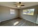 Bright bedroom with new flooring and large windows at 1018 4Th St, Port Orange, FL 32129