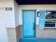 Inviting front entrance with light blue door and brick facade at 1018 4Th St, Port Orange, FL 32129