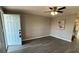 Bright and airy living room with wood-look flooring and ceiling fan at 1018 4Th St, Port Orange, FL 32129