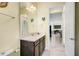 Elegant bathroom with a vanity, toilet, and view into another room at 10233 Henbury St, Orlando, FL 32832