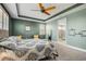 Spacious bedroom with a ceiling fan and en-suite bathroom at 10233 Henbury St, Orlando, FL 32832