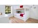 bedroom with a wooden bunk bed featuring playful decor and a window letting in lots of natural light at 103 Rum Run # 103, Davenport, FL 33837